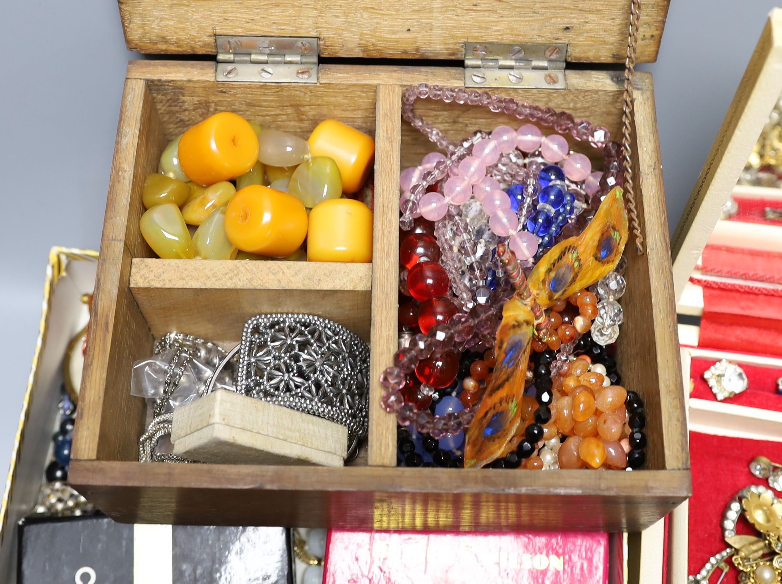 Assorted costume jewellery including gem set stick pins, hat pins, necklaces etc.